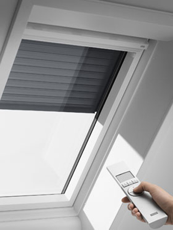 Ellectrically operated Velux blinds.